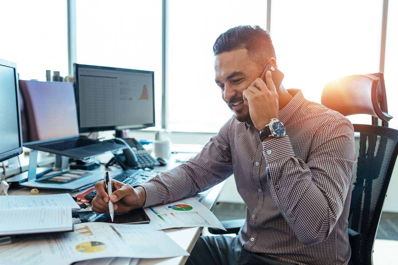 Entrepreneur Discussing Work Over Phone